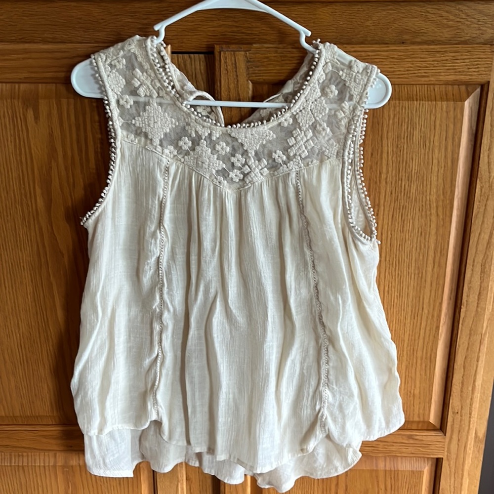Cream sleeveless top